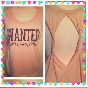 Tank top that says WANTED. Has an open back/ sides